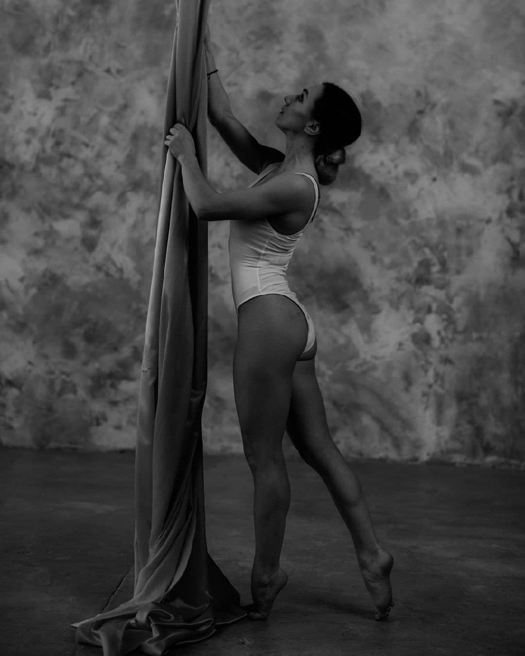 Standing figure meeting the suspended blue fabric